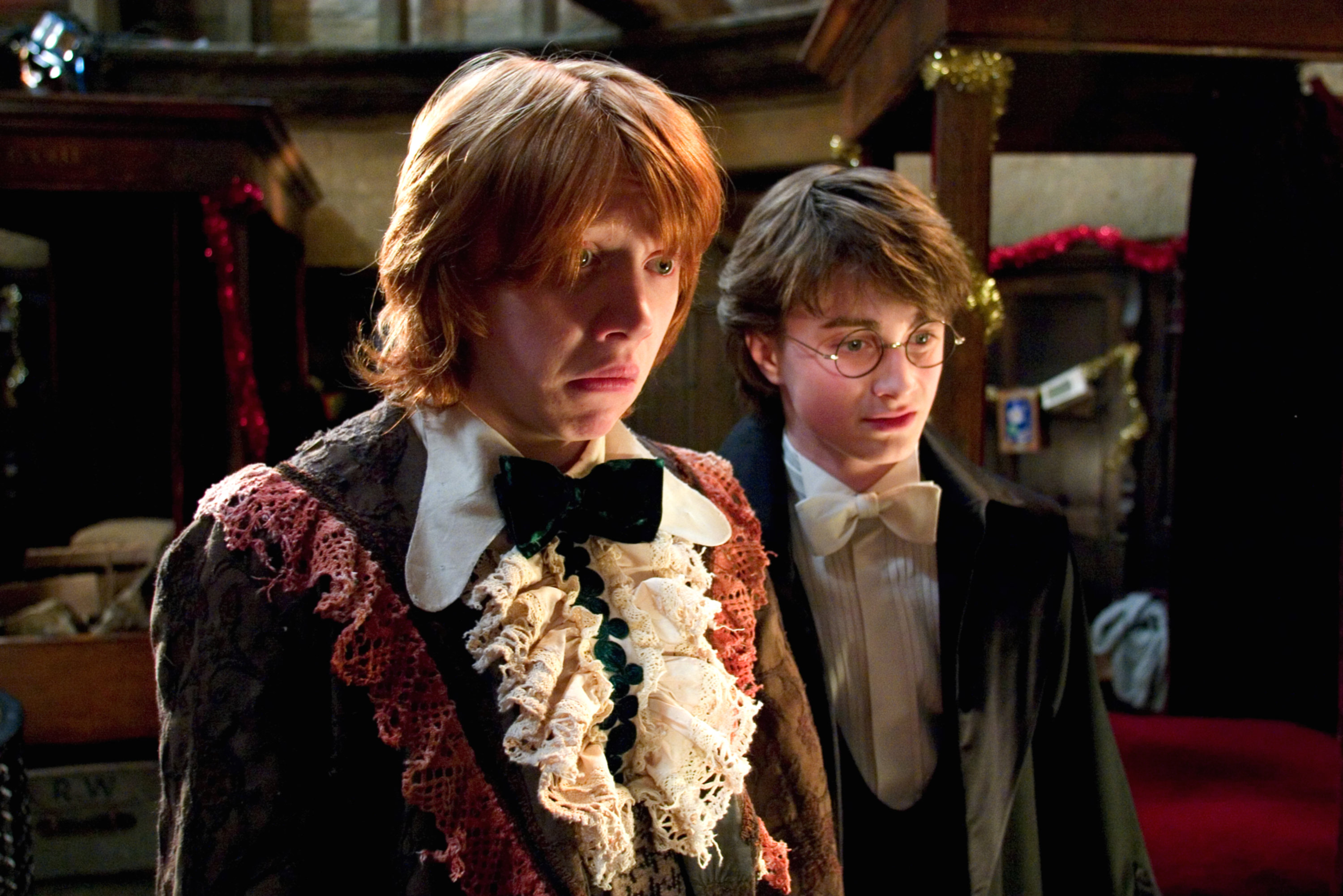 Ron and Harry looking at their dress robes from the Goblet of Fire